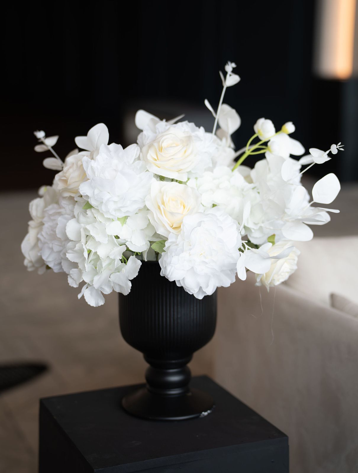 Blush peonies, cream garden roses and eucalyptus arranged by Trendy Blooms